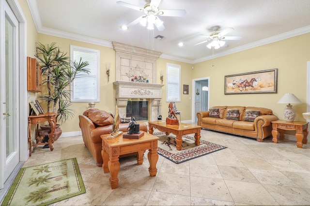 living room featuring ceiling fan, ornamental molding, and a fireplace