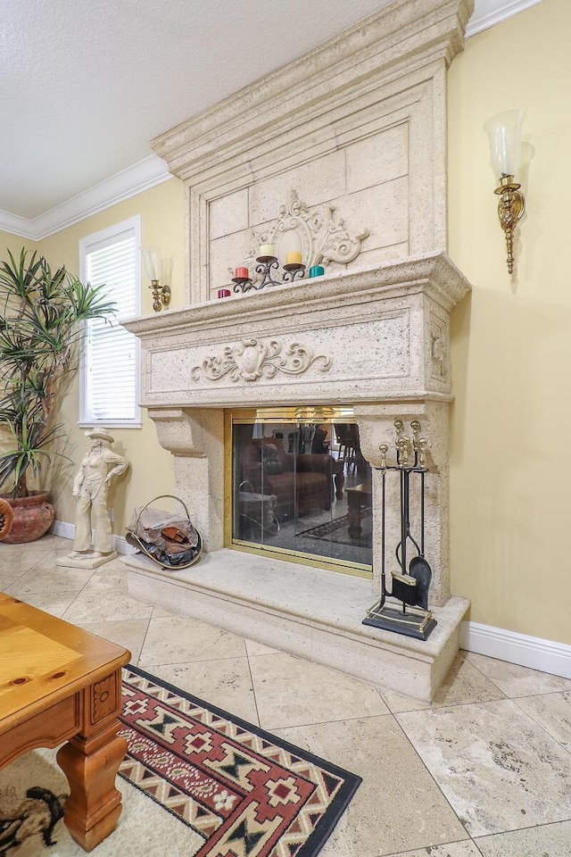 room details with ornamental molding, a textured ceiling, and a premium fireplace