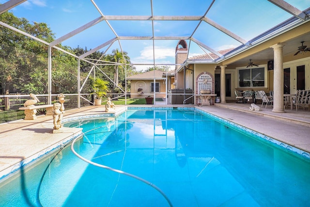 view of pool featuring ceiling fan, a lanai, a patio, and french doors