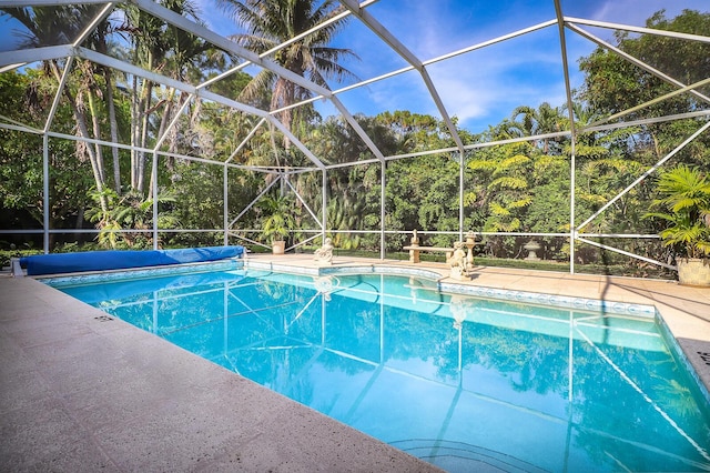 view of pool featuring a patio area and a lanai