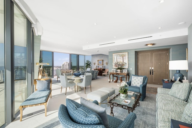 carpeted living room with floor to ceiling windows