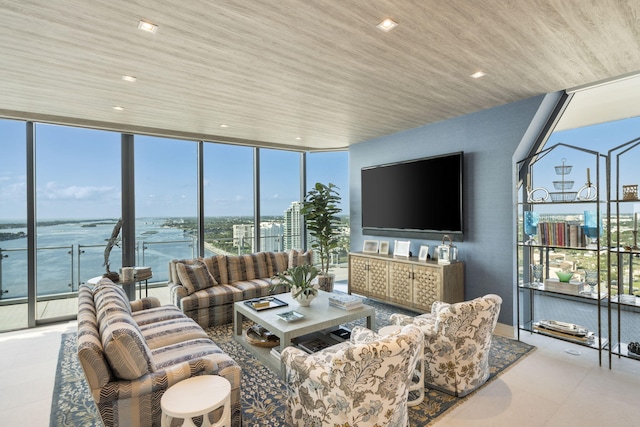 living room with floor to ceiling windows, a water view, and wood ceiling