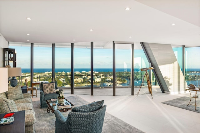 living room with floor to ceiling windows and a water view