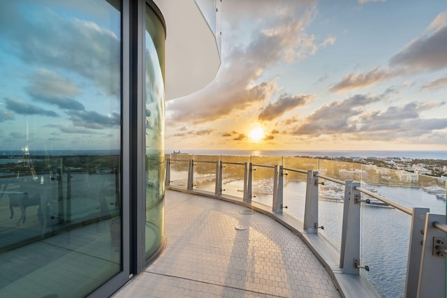 balcony at dusk with a water view