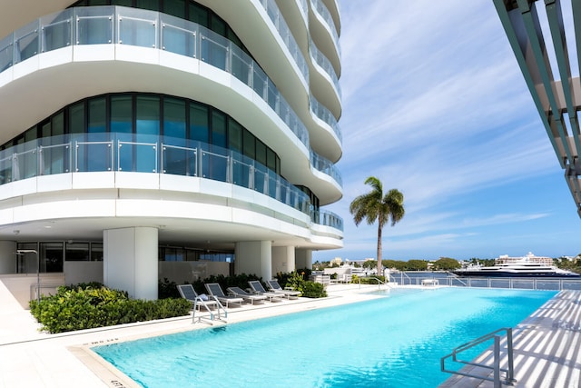 view of swimming pool featuring a patio