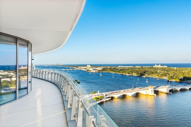 balcony featuring a water view