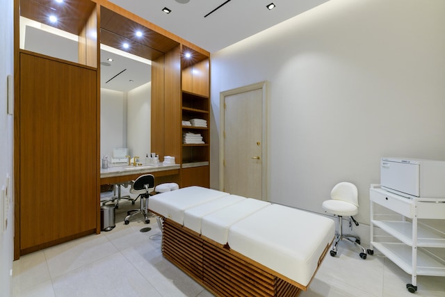 bedroom with light tile patterned floors