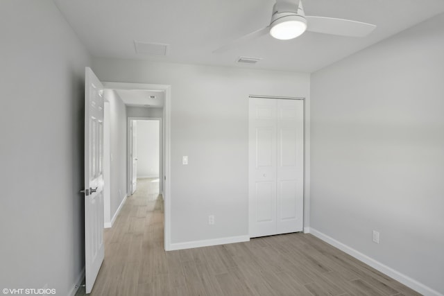 empty room featuring hardwood / wood-style flooring and ceiling fan