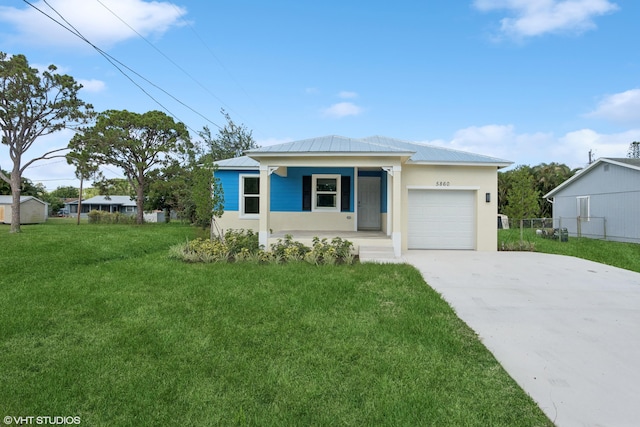 view of front of home with a front lawn, covered porch, and a garage