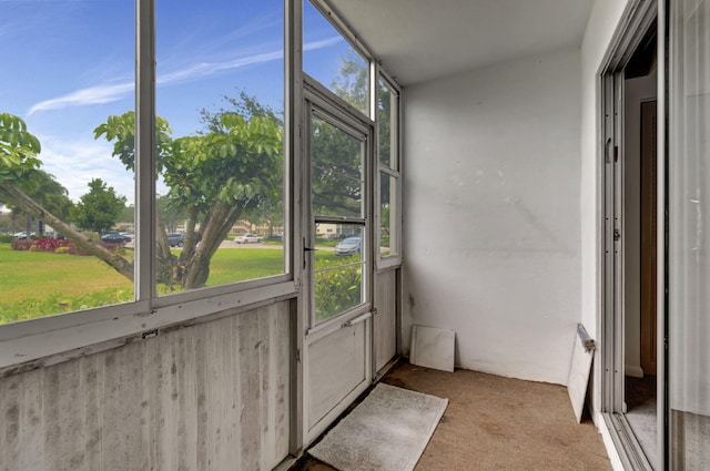 unfurnished sunroom featuring a healthy amount of sunlight