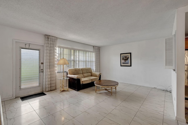 living room with a textured ceiling