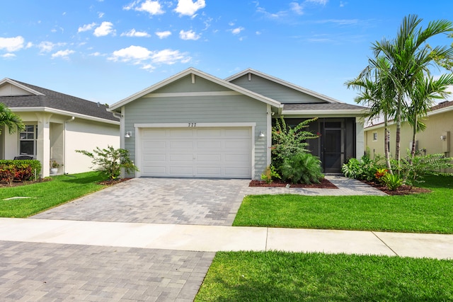 view of front facade featuring a garage and a front lawn