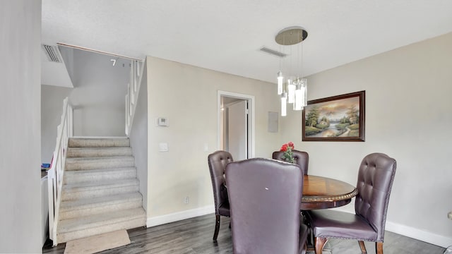 dining space featuring dark hardwood / wood-style floors