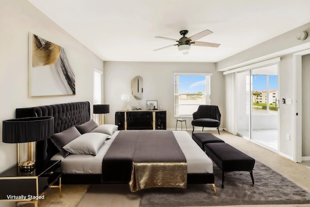 carpeted bedroom with ceiling fan