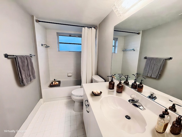 full bathroom with tile patterned floors, vanity, toilet, and shower / bath combo with shower curtain