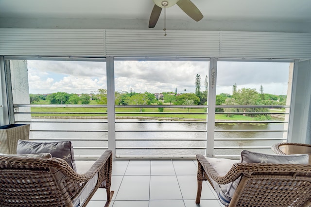 sunroom featuring ceiling fan