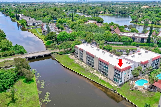 birds eye view of property with a water view