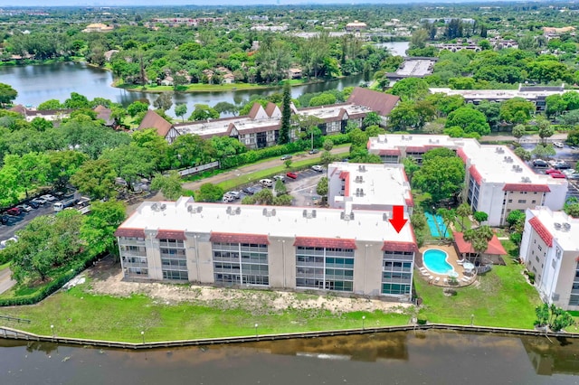 birds eye view of property with a water view