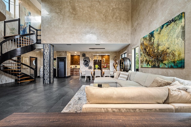 living room featuring a high ceiling