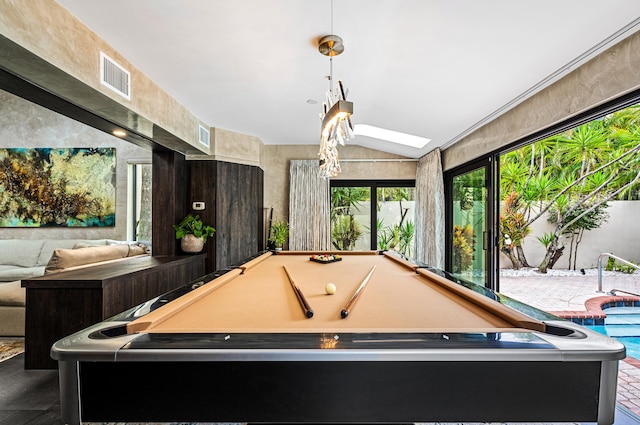 rec room with vaulted ceiling with skylight and pool table