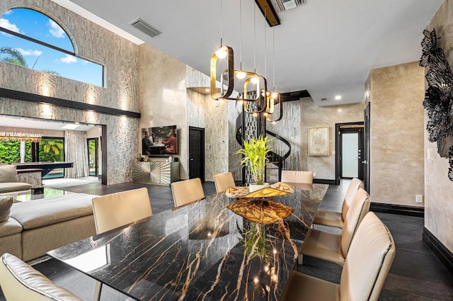 dining room with a notable chandelier and pool table