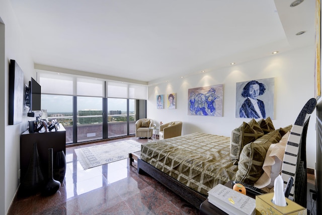 bedroom featuring tile flooring and expansive windows