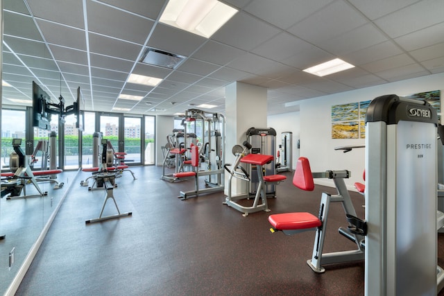 gym featuring a paneled ceiling