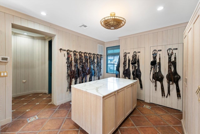 interior space featuring dark tile flooring