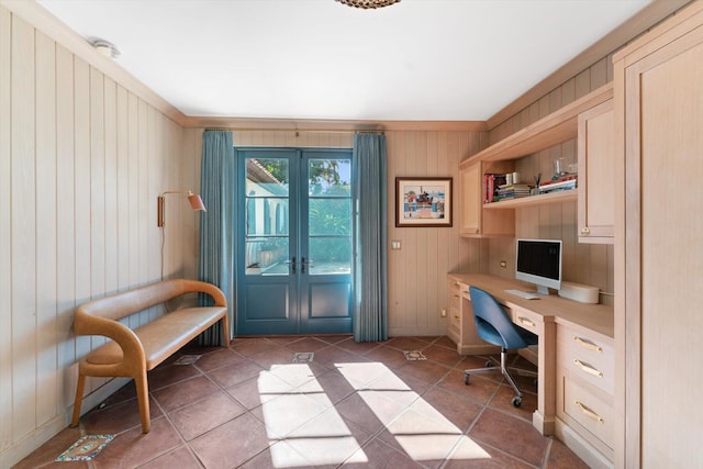 office space featuring tile floors, french doors, and wood walls