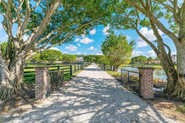 surrounding community featuring a water view