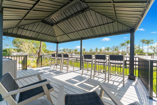 wooden terrace featuring a gazebo