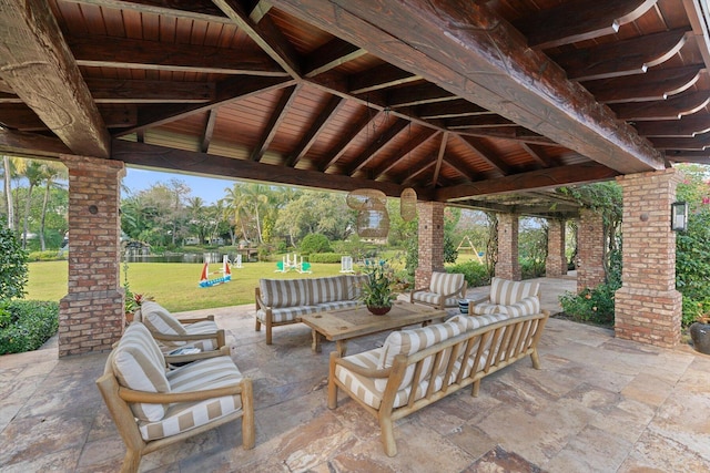 view of patio / terrace with outdoor lounge area, a playground, and a gazebo