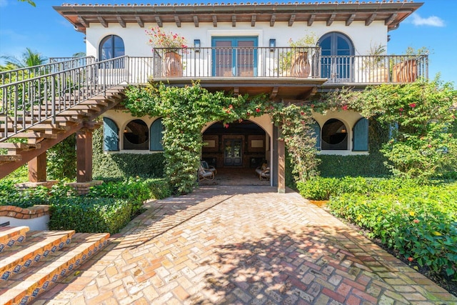 view of front of home with a balcony