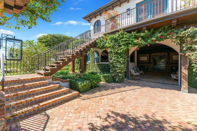 doorway to property with a patio area