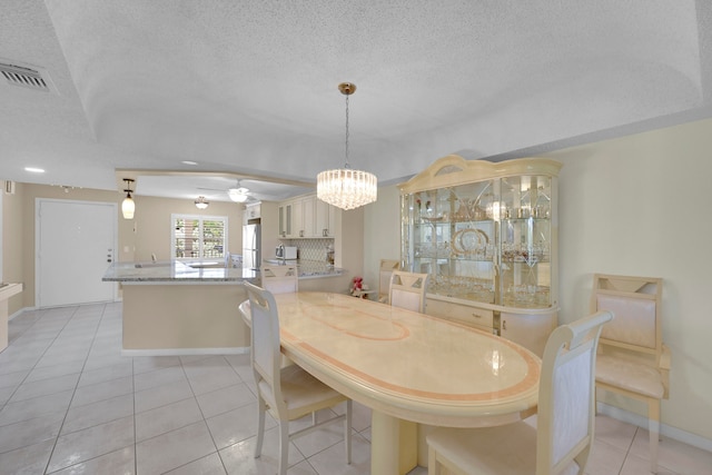 kitchen featuring kitchen peninsula, ceiling fan, sink, pendant lighting, and dishwasher