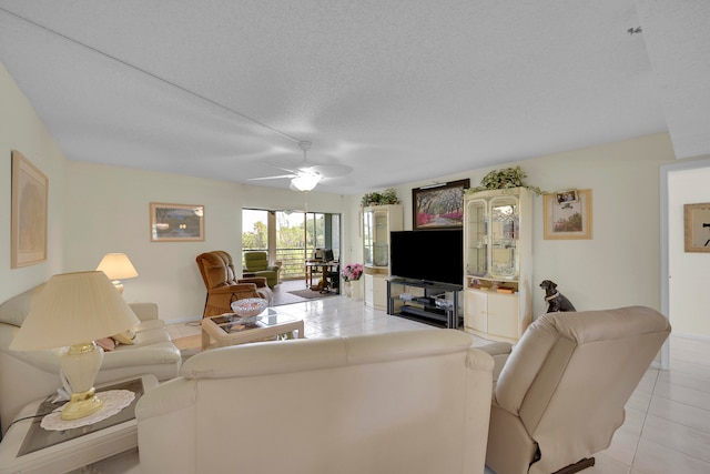 dining room featuring light tile patterned flooring and a textured ceiling