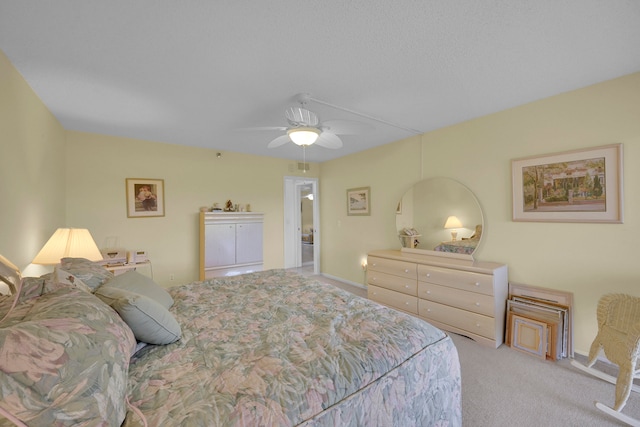 living room featuring a textured ceiling, ceiling fan, and light tile patterned flooring