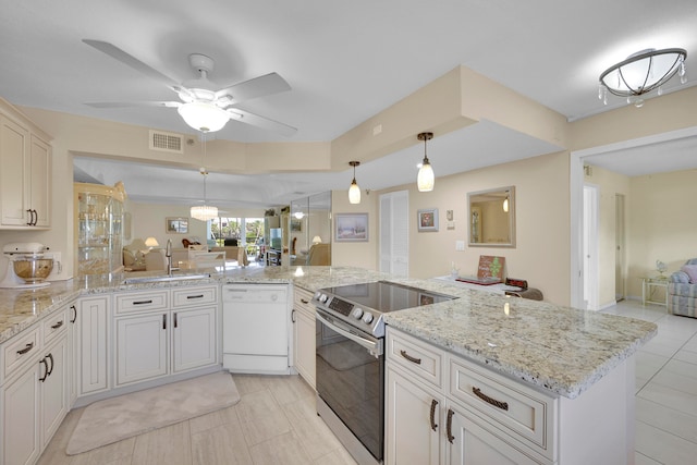 kitchen featuring pendant lighting, backsplash, ceiling fan, light tile patterned flooring, and kitchen peninsula