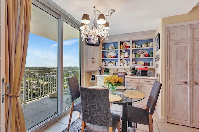 tiled dining room with a notable chandelier