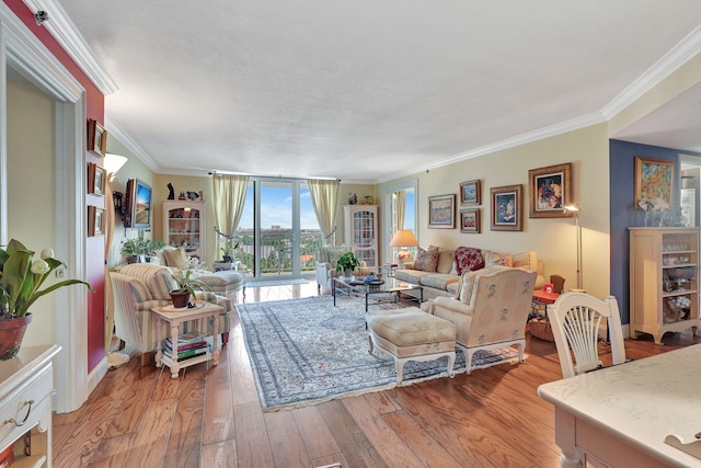 living room with ornamental molding, expansive windows, and wood-type flooring