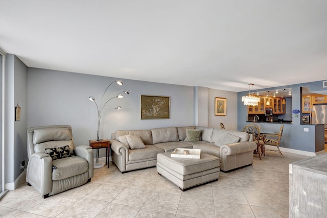 tiled living room featuring an inviting chandelier