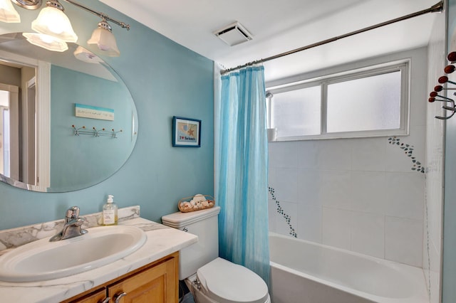 full bathroom featuring plenty of natural light, toilet, and vanity with extensive cabinet space