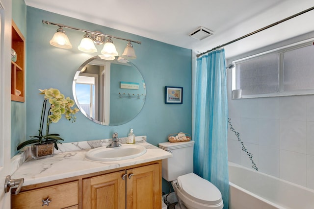 full bathroom featuring shower / tub combo, vanity, and toilet