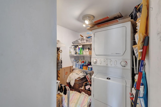 laundry area featuring stacked washing maching and dryer