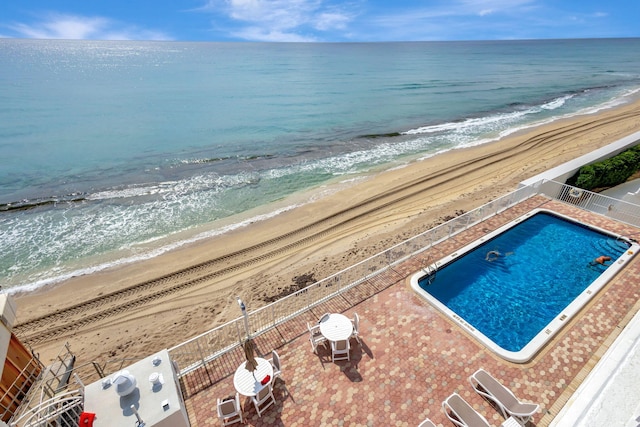 exterior space with a beach view and a water view