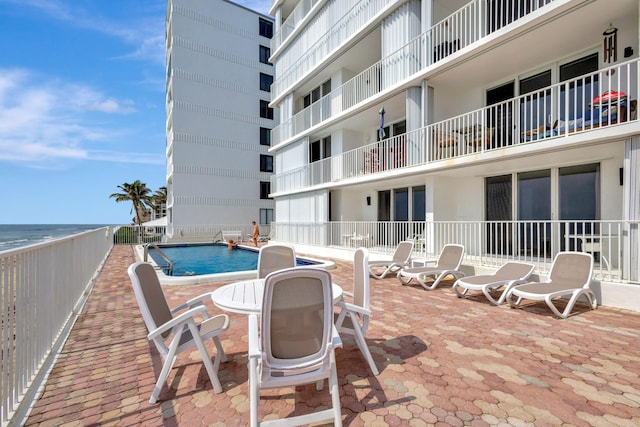 view of swimming pool with a patio