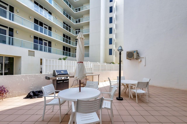 view of terrace featuring grilling area and a wall mounted air conditioner