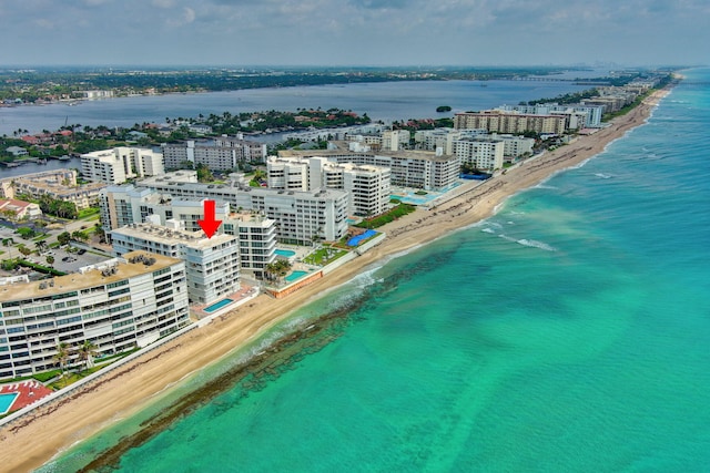 bird's eye view with a beach view and a water view