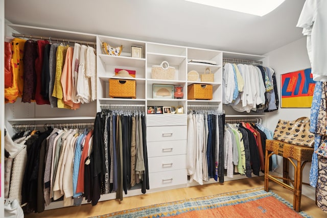 spacious closet with light hardwood / wood-style floors