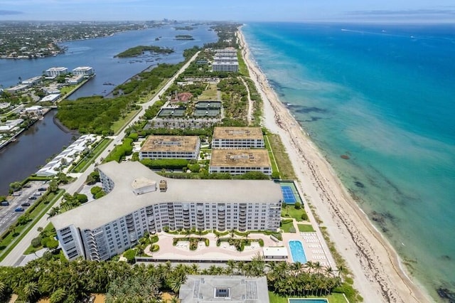 bird's eye view featuring a water view and a view of the beach